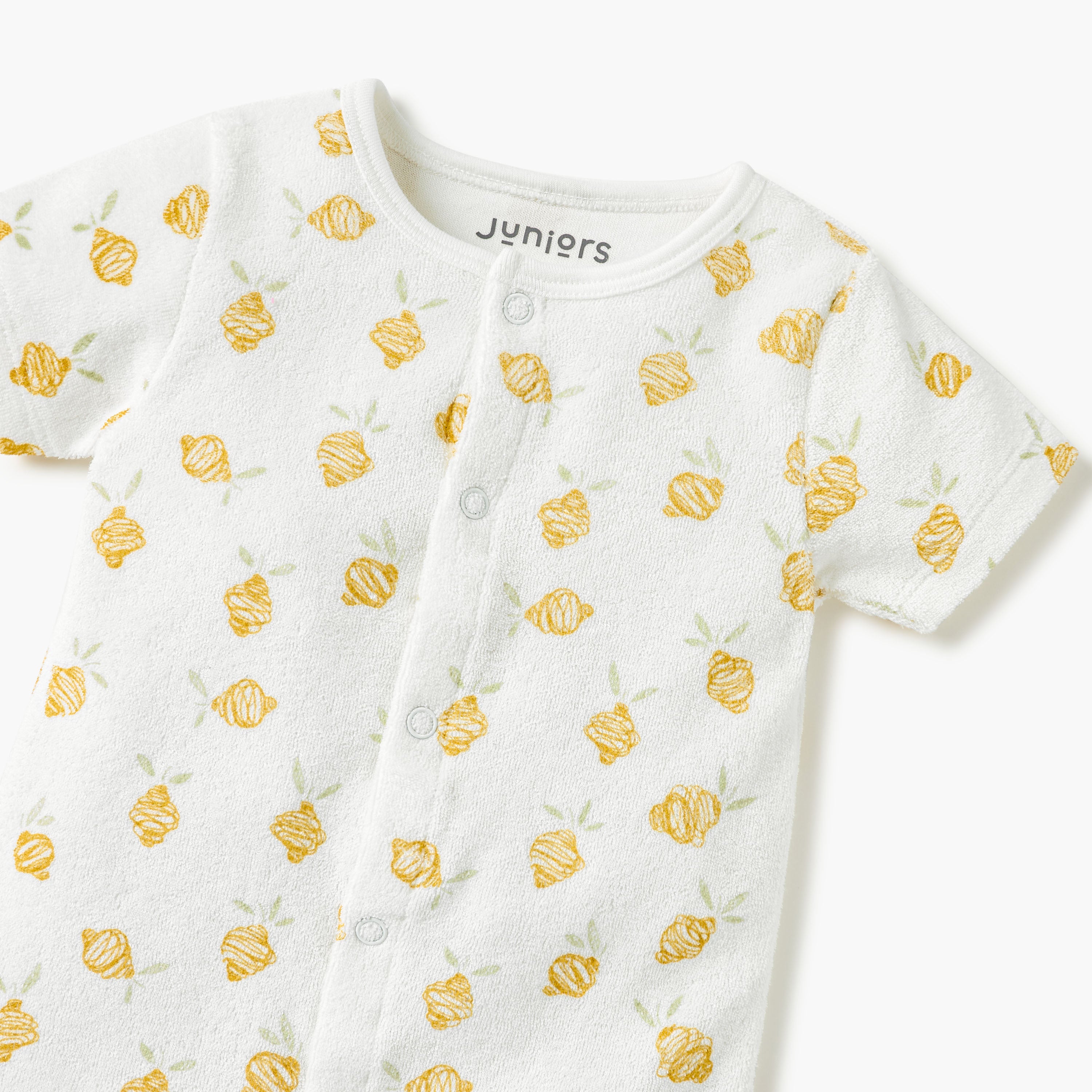 Juniors Printed Romper with Short Sleeves and Button Closure