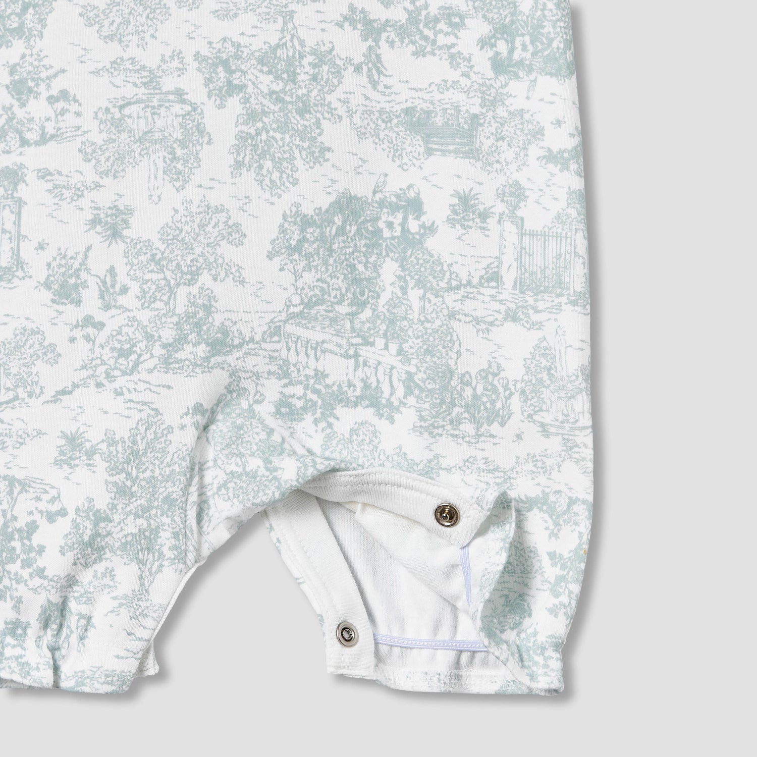 Giggles Crew Neck Sleeveless Romper with Floral Embroidery